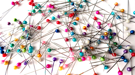 Needles for tailors. Tools for sewing. Tailoring needles. On a white background.の写真素材