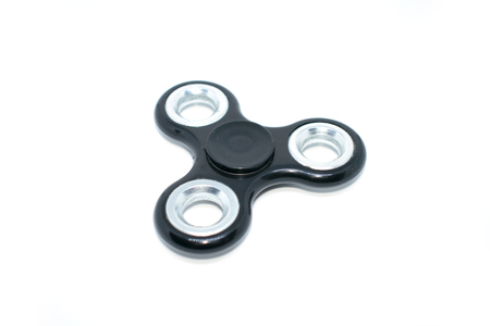 A toy for fun. Fun, have fun. Photo of a black spinner. For relaxation.の写真素材