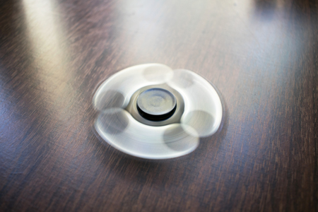 A toy for fun. Fun, have fun. Photo of a black spinner. For relaxation.の写真素材
