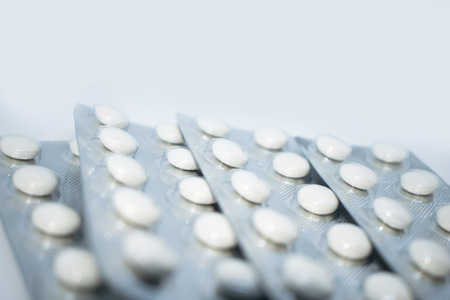 Multicolored tablets in transparent packaging. Medical products to maintain good health and...