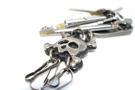 Bunch of keys. Photo of different keys from the door. On a white background.の写真素材
