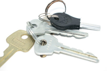 Bunch of keys. Photo of different keys from the door. On a white background.