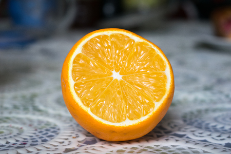 Half a lemon on the tablecloth. Home atmosphere, dining table, lemon.の写真素材