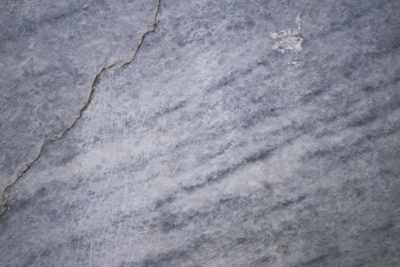 Photo texture gray stone, embossed. Natural natural monolith. Gray marble.の写真素材