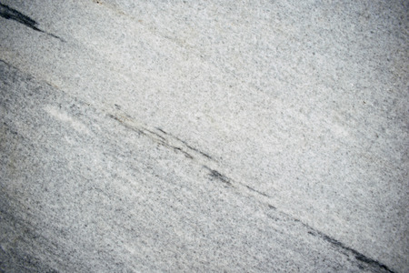 Photo texture gray stone, embossed. Natural natural monolith. Gray marble.の写真素材