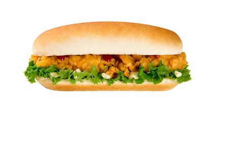 Hamburger with chicken nuggets, herbs, tomatoes in a bun. On a dark background.の写真素材