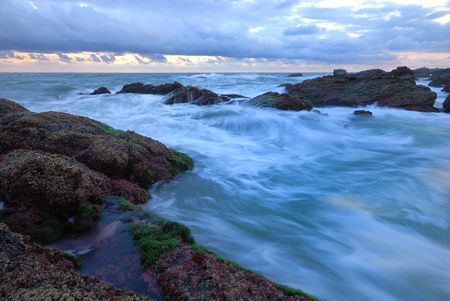 Blue skies over time-lapse waterの写真素材