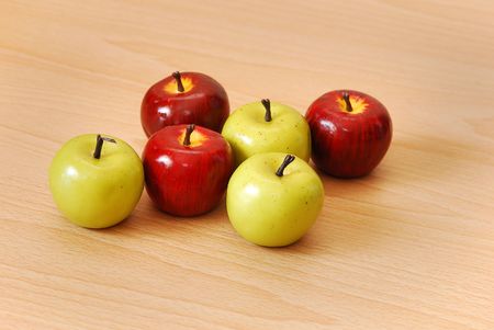 Three red and three green applesの写真素材