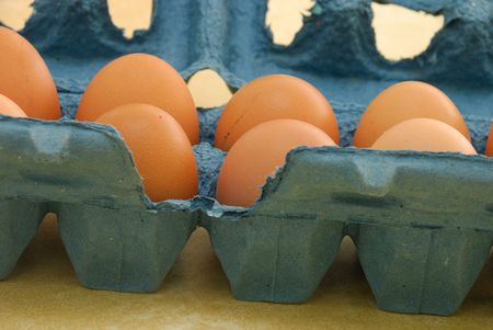 Eggs in a blue containerの写真素材
