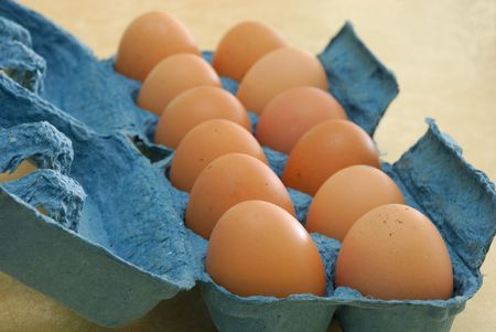 Eggs in a blue containerの写真素材