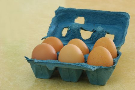 Eggs in a blue containerの写真素材