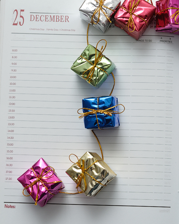 Diary open on the 25th of December decorated with gifts