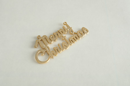 Merry Christmas in gold text isolated on a white background