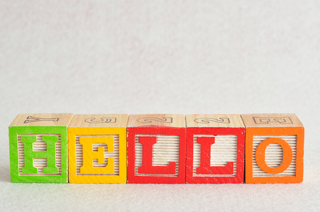 The word hello spelled with colorful alphabet blocks isolated against a white backgroundの写真素材