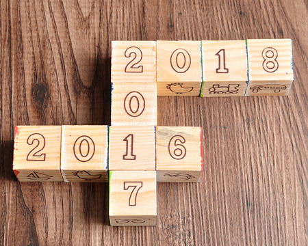 2016 2017 2018 written with wooden blocks on woodenの写真素材