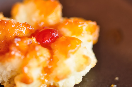 Close up of a golden coconut macaroon