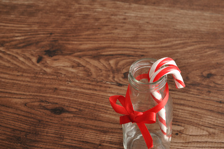 Candy cane displayed in a bottle