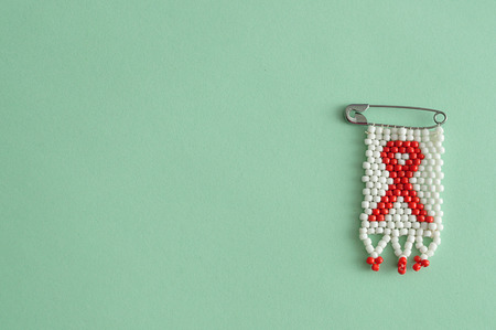An aids ribbon as a bead work pin isolated