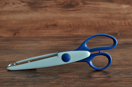 A colorful scissor that cut a zigzag patternの写真素材