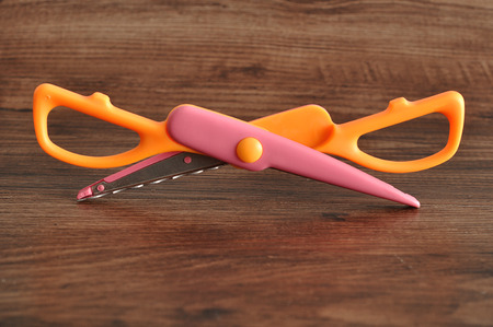A colorful scissor that cut a zigzag patternの写真素材