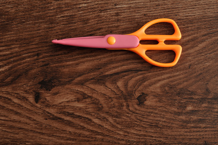A colorful scissor that cut a zigzag patternの写真素材