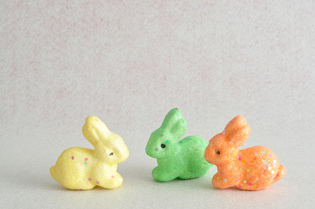 A row of colorful bunnies used for decoration over the easter period isolated on a white backgroundの写真素材