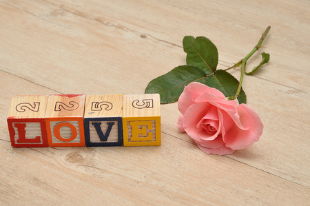 Valentine's Day.Love Spelled with colorful alphabet blocks and a pink heartの写真素材
