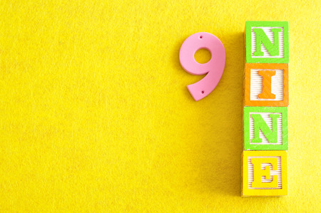 Number 9 displayed as a word and a numberの写真素材