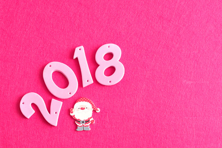2018 in pink numbers with a Santa Clauseの写真素材