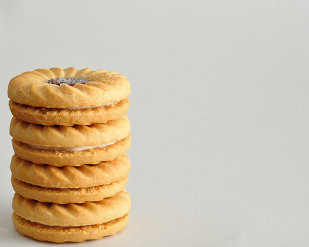 A stack of golden brown biscuitsの写真素材