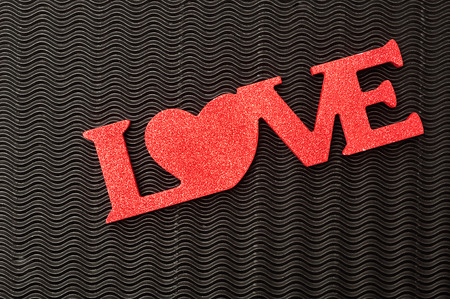 Valentines day. The word love displayed against a black backgroundの写真素材