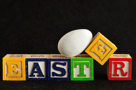 Easter spelled with alphabet blocks and a easter egg