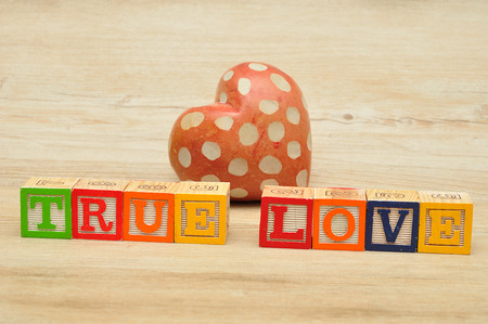 Valentine's Day. True love spelled with colorful alphabet blocks and a red heartの写真素材