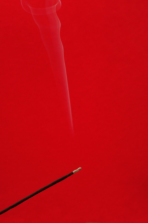 Abstract white smoke from an incense sticksの写真素材