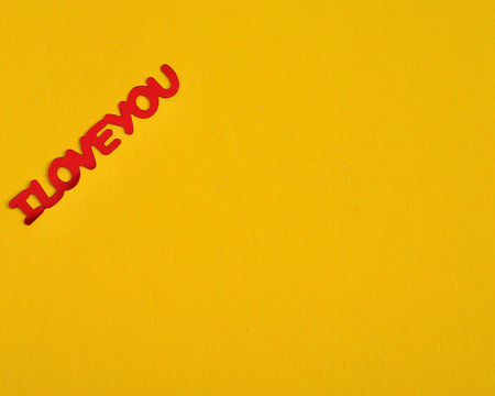 Valentine's Day. I Love You in red letters isolated on a yellow backgroundの写真素材
