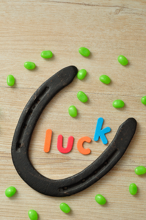 The word luck with a horse shoe with green jellybeansの写真素材