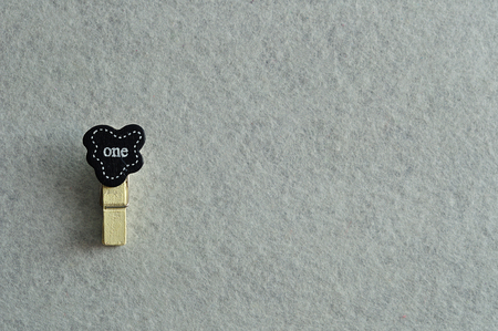 The word one on a colorful peg on a white backgroundの写真素材