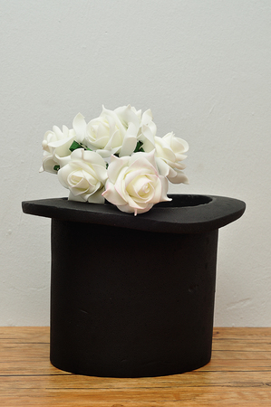 A bunch of white roses in a magicians hatの写真素材