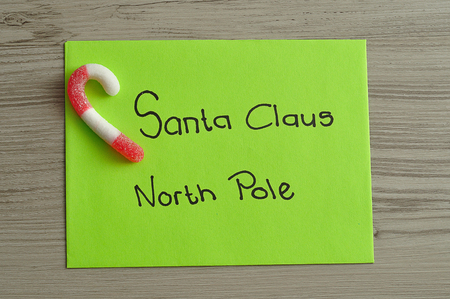 A letter to Santa Claus at the North Pole with a candy caneの写真素材