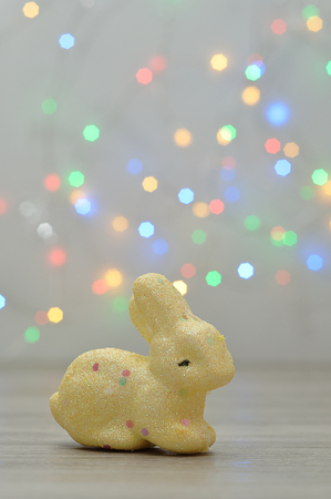 A small bunny figurine displayed against an out of focus light background for easterの写真素材