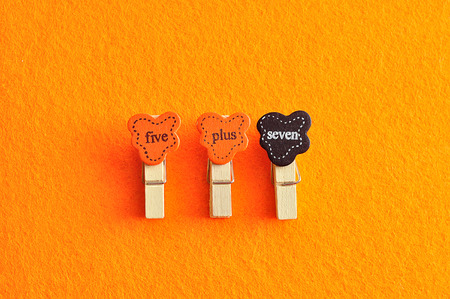 Five plus seven on an orange background
