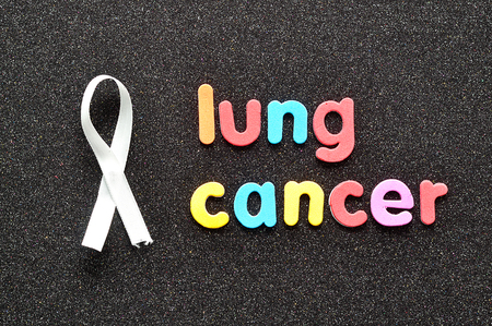 The words lung cancer with a white awareness ribbonの写真素材