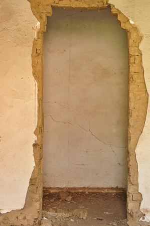 A doorway in an abandoned farmhouseの写真素材
