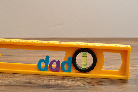 The word dad displayed with a levelの写真素材