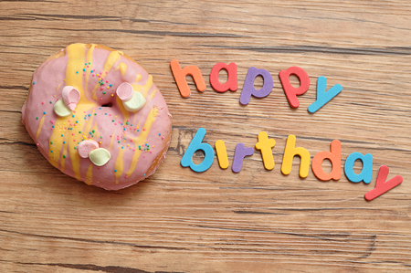 Happy birthday with a doughnutの写真素材