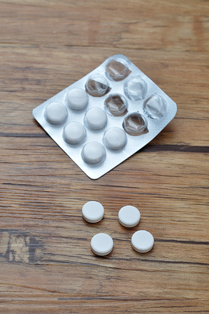 White pills displayed with a blister packの写真素材