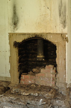 A fireplace in an old abandoned houseの写真素材