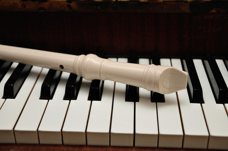 A flute on top of piano keysの写真素材