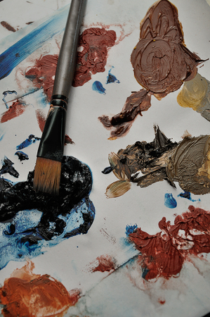 Splashes of paint with a paintbrush on a white backgroundの写真素材