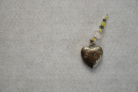 A decorated steel heart on a white backgroundの写真素材